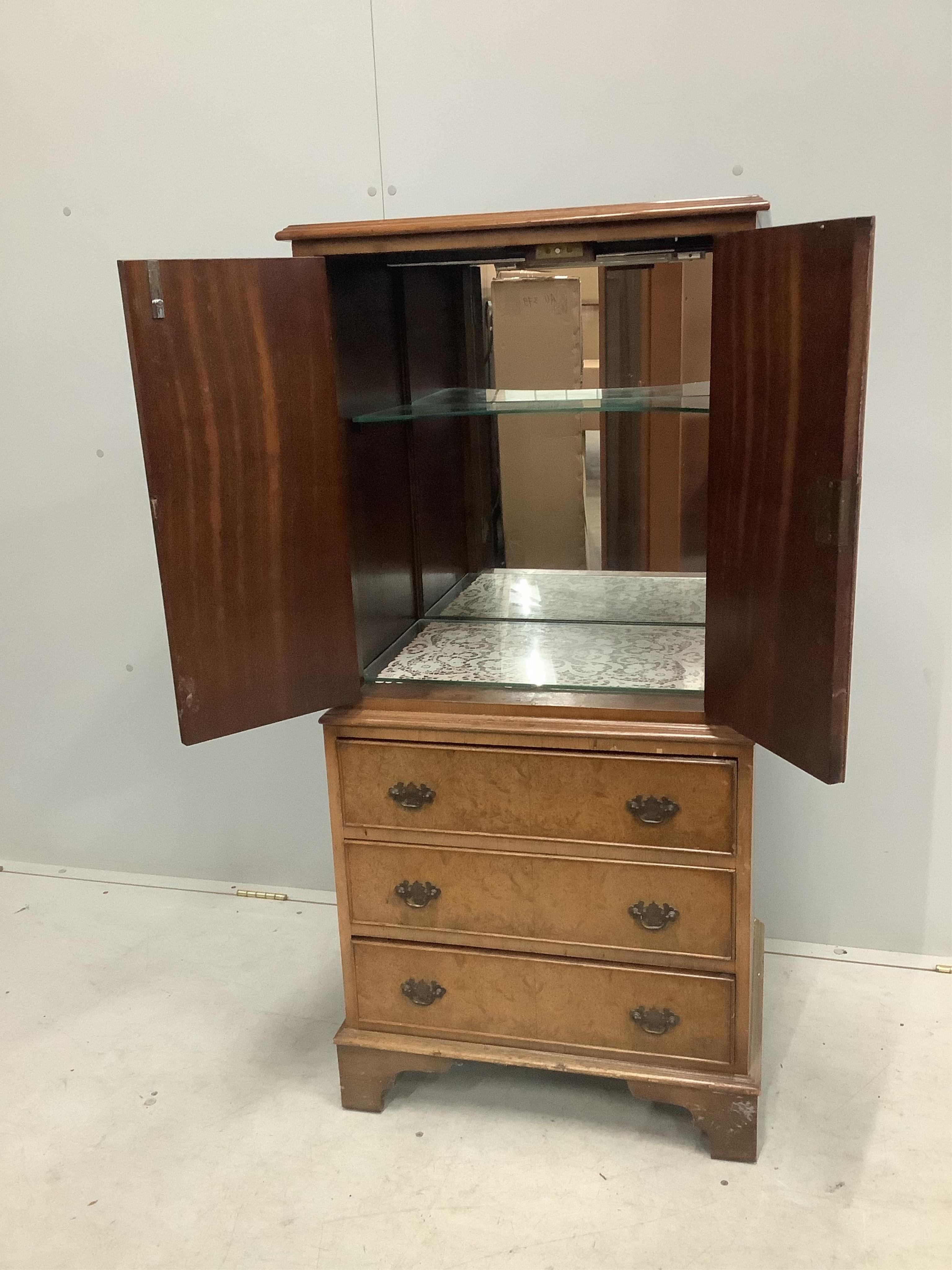 A Queen Anne Revival walnut cocktail cabinet, width 58cm, depth 43cm, height 126cm. Condition - fair to good